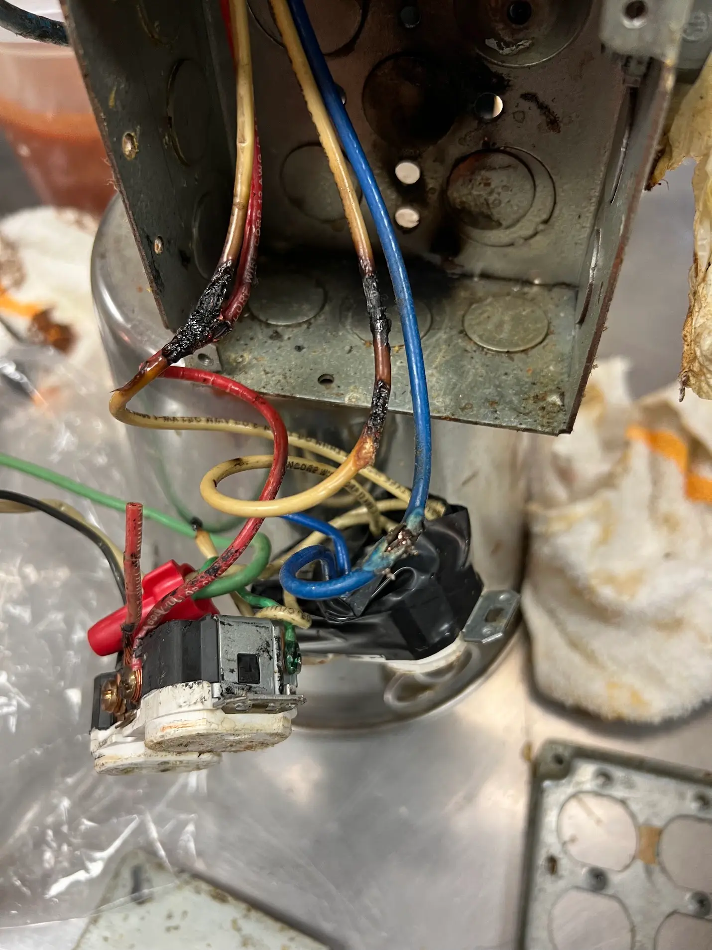 Burned wiring inside an electrical box found during troubleshooting