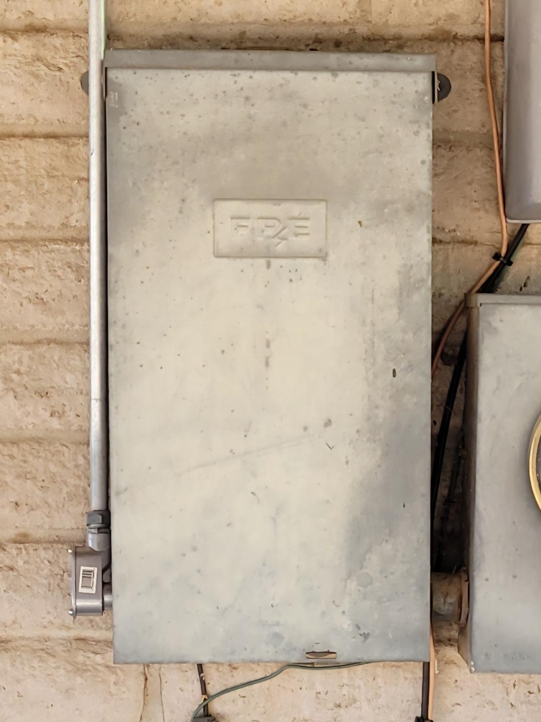 Closed Federal Pacific electrical panel before replacement